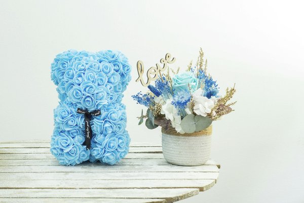 Ours en rose avec boîte : la douceur à portée de main